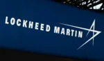 This photograph taken on June 13, 2022, shows the logo from US defence manufacturer Lockheed Martin on display at the Eurosatory international land and airland defence and security trade fair, in Villepinte, a northern suburb of Paris. (Photo by EMMANUEL DUNAND / AFP) (Photo by EMMANUEL DUNAND/AFP via Getty Images)