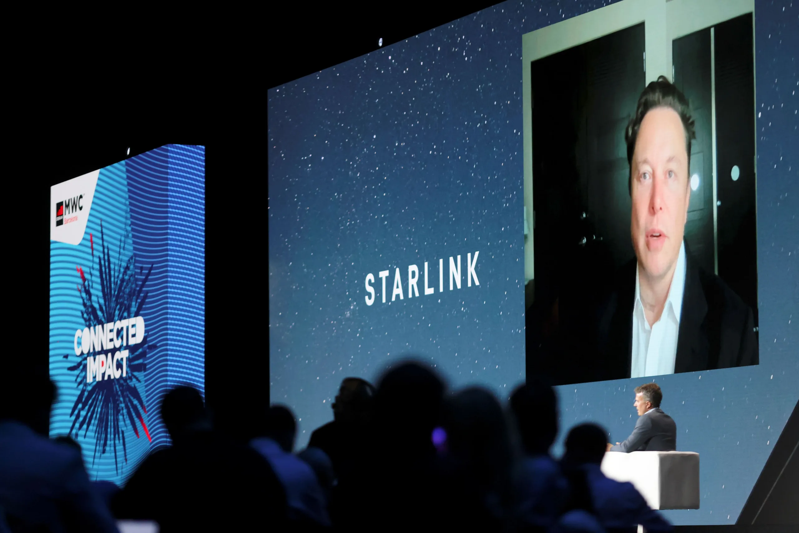 FILE PHOTO: SpaceX founder and Tesla CEO Elon Musk speaks on a screen during the Mobile World Congress (MWC) in Barcelona, Spain, June 29, 2021. REUTERS/Nacho Doce/File Photo