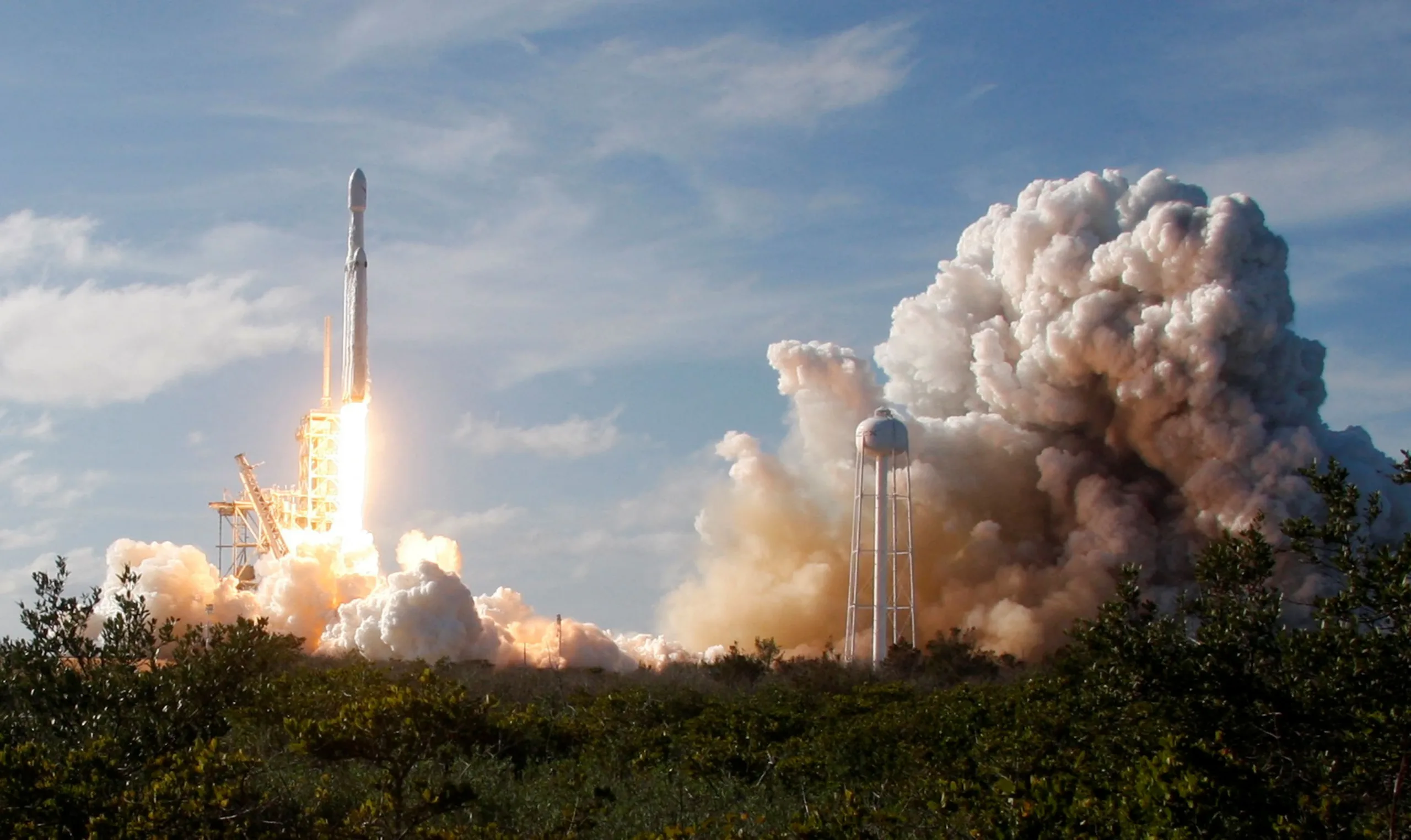A SpaceX Falcon Heavy rocket lifts off from historic launch pad 39-A at the Kennedy Space Center in Cape Canaveral, Florida, U.S., February 6, 2018. REUTERS/Thom Baur/File Photo