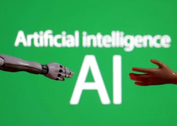 Words reading "Artificial intelligence AI", miniature of robot and toy hand are pictured in this illustration taken December 14, 2023. REUTERS/Dado Ruvic/Illustration