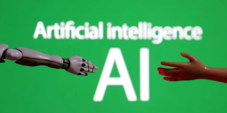 Words reading "Artificial intelligence AI", miniature of robot and toy hand are pictured in this illustration taken December 14, 2023. REUTERS/Dado Ruvic/Illustration