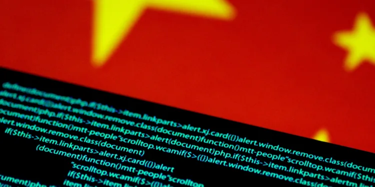 FILE PHOTO: Computer code is seen on a screen above a Chinese flag in this July 12, 2017 illustration photo. REUTERS/Thomas White/Illustration/File Photo