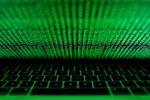 FILE PHOTO: A computer keyboard lit by a displayed cyber code is seen in this illustration picture taken on March 1,  2017. REUTERS/Kacper Pempel/Illustration
