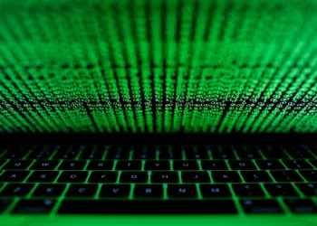 FILE PHOTO: A computer keyboard lit by a displayed cyber code is seen in this illustration picture taken on March 1,  2017. REUTERS/Kacper Pempel/Illustration