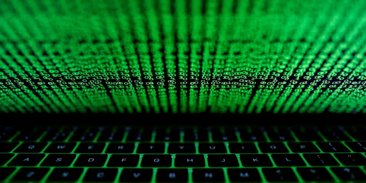 FILE PHOTO: A computer keyboard lit by a displayed cyber code is seen in this illustration picture taken on March 1, 2017. REUTERS/Kacper Pempel/Illustration