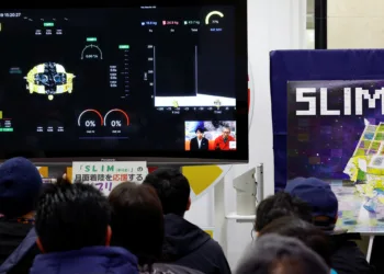 FILE PHOTO: People watch the Smart Lander for Investigating Moon (SLIM)'s landing on the moon in a public viewing event in Sagamihara, south of Tokyo, Japan January 20, 2024. REUTERS/Kim Kyung-Hoon/File Photo