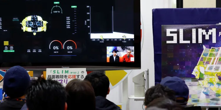 FILE PHOTO: People watch the Smart Lander for Investigating Moon (SLIM)'s landing on the moon in a public viewing event in Sagamihara, south of Tokyo, Japan January 20, 2024. REUTERS/Kim Kyung-Hoon/File Photo