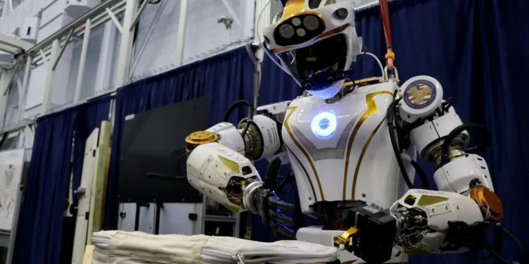 NASA's humanoid robot Valkyrie opens a bag at the Johnson Space Center in Houston, Texas, U.S., November 16, 2023. REUTERS/Evan Garcia