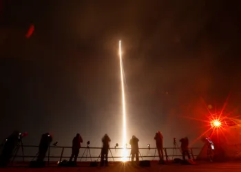 People take photographs during the launch of Boeing-Lockheed joint venture United Launch Alliance's next-generation Vulcan rocket on its debut flight from Cape Canaveral, Florida, U.S. January 8, 2024. REUTERS/Joe Skipper