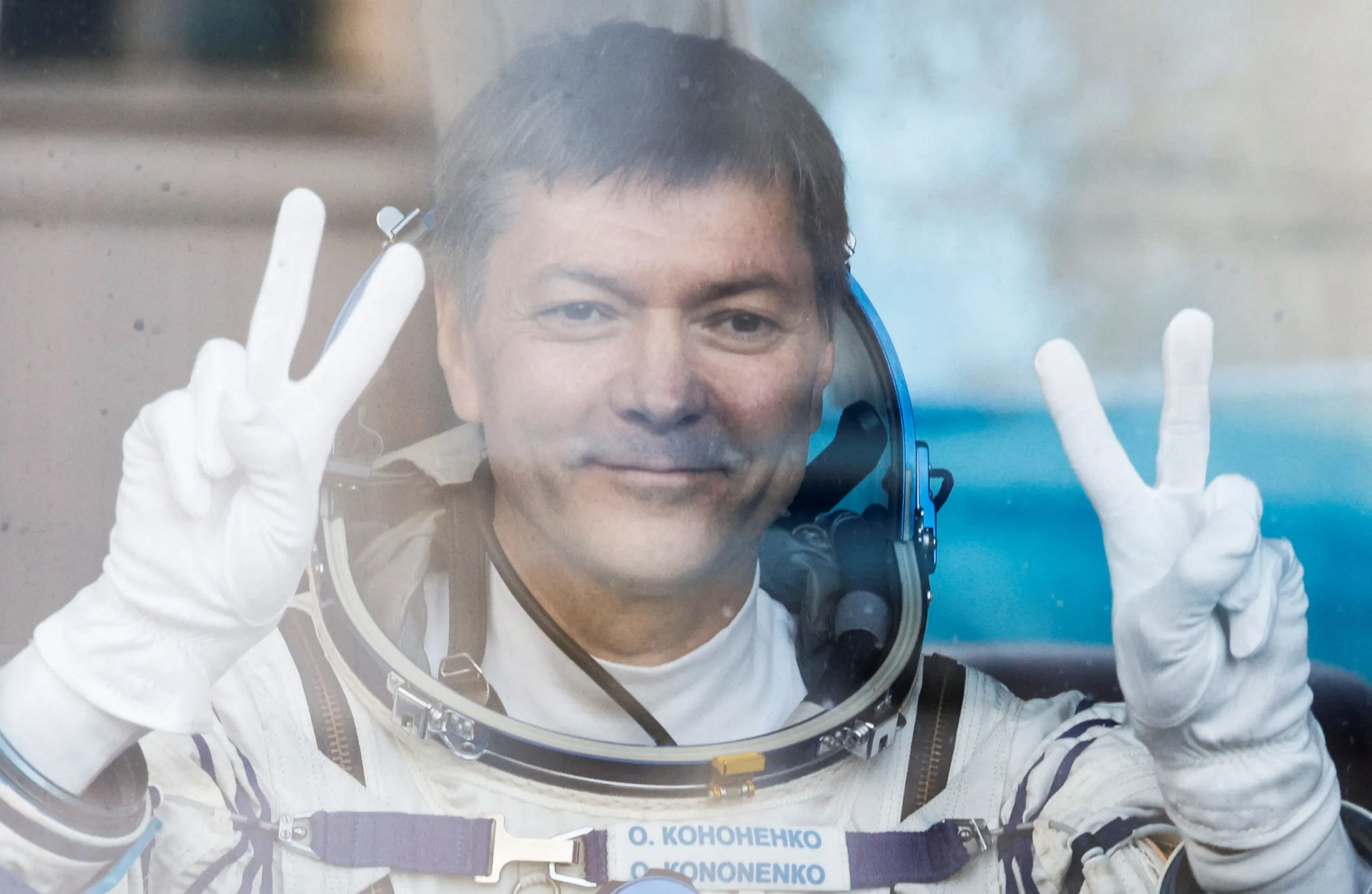 FILE PHOTO: Roscosmos cosmonaut Oleg Kononenko reacts in the bus just before the departure to the launchpad at the Baikonur Cosmodrome, Kazakhstan September 15, 2023. REUTERS/Maxim Shemetov/Pool/File Photo