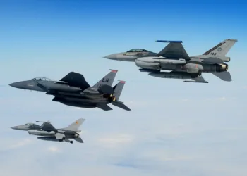 An U.S. Air Force F-15E Strike Eagle, Royal Netherlands Air Force F-16 (top) and Belgian Component F-16 (bottom) conduct aerial operations over the North Sea, July 17, 2020. Interoperability and collective readiness, deter potential adversaries and ensure the skies within the European theater remain sovereign. (U.S. Air Force photo by Master Sgt. Matthew Plew)