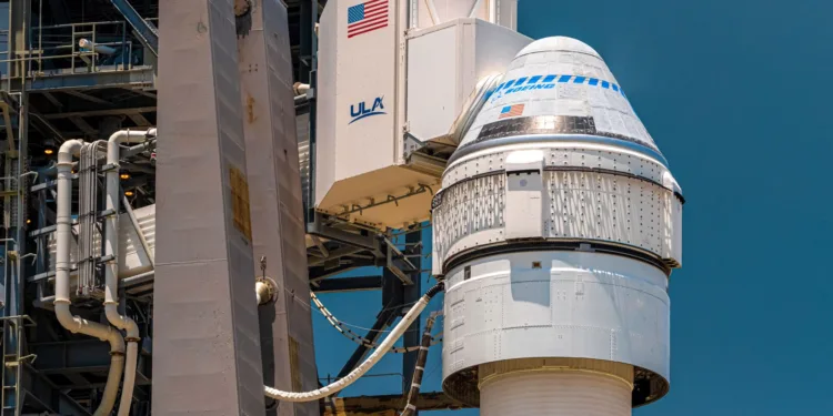 Close-up of the Boeing CST-100 Starliner capsule, white room attached, atop the mighty Atlas V launch vehicle at Cape Canaveral's SLC-41.