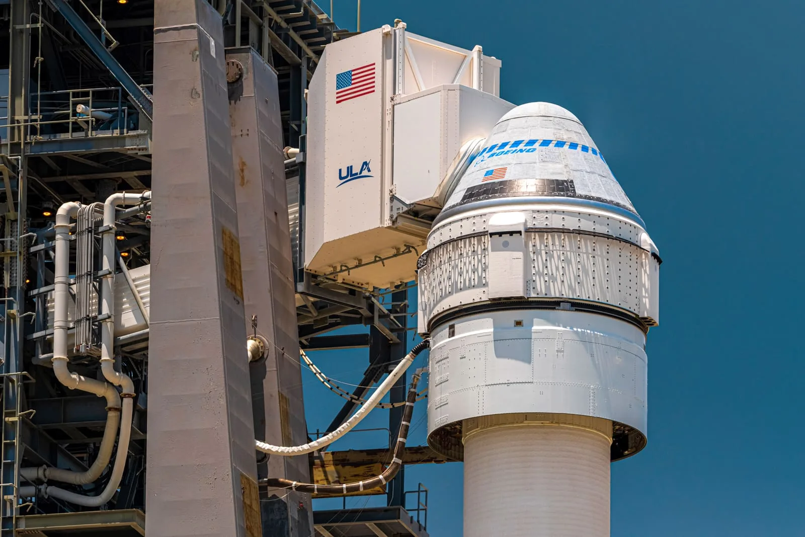 Close-up of the Boeing CST-100 Starliner capsule, white room attached, atop the mighty Atlas V launch vehicle at Cape Canaveral's SLC-41.