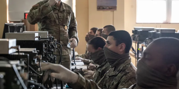 Soldiers in advanced individual training on Fort Sill learn about the single channel ground and airborne radio system on Fort Sill, Okla., April 21, 2020. Students and instructors are required to wear face masks.