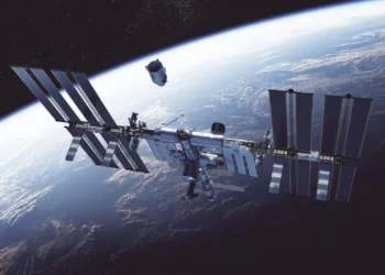Commercial Spacecraft Docking To International Space Station On Background Of Earth. 3D Illustration.