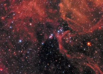 This new image of the supernova remnant SN 1987A was taken by the NASA/ESA Hubble Space Telescope in January 2017 using its Wide Field Camera 3 (WFC3). Since its launch in 1990 Hubble has observed the expanding dust cloud of SN 1987A several times and this way helped astronomers to create a better understanding of these cosmic explosions. Supernova 1987A is located in the centre of the image amidst a backdrop of stars. The bright ring around the central region of the exploded star is composed of material ejected by the star about 20 000 years before the actual explosion took place. The supernova is surrounded by gaseous clouds. The clouds’ red colour represents the glow of hydrogen gas. The colours of the foreground and background stars were added from observations taken by Hubble’s Wide Field Planetary Camera 2 (WFPC2).