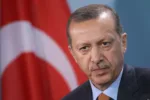 BERLIN, GERMANY - NOVEMBER 02:  Turkish Prime Minister Recep Tayyip Erdogan speaks to the media following talks with German Chancellor Angela Merkel at the Chancellery on November 2, 2011 in Berlin, Germany. Earlier in the day the two leaders attended a celebration to mark 50 years of Turkish immigration to Germany. On October 30, 1961 Turkey and what was then West Germany signed an agreement that paved the way for the migration of Turkish "guest workers" to Germany. Germany in the early 1960s, which in many ways was still recovering from the devastation of World War II, required foreign labour to fill its industrial workforce, and the influx of immigrants from Turkey, Italy, Greece and other south European countries made Germany?s "economic miracle" possible. Today large numbers of Germans with Turkish roots are an integral part of German society, though integration and assimilation remain a contentious issue, especially for more recent Turkish immigrants.  (Photo by Sean Gallup/Getty Images)