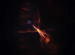 This is HOPS-315, a baby star where astronomers have observed evidence for the earliest stages of planet formation. The image was taken with the Atacama Large Millimeter/submillimeter Array (ALMA), in which ESO is a partner. Together with data from the James Webb Space Telescope (JWST), these observations show that hot minerals are beginning to solidify. In orange we see the distribution of carbon monoxide, blowing away from the star in a butterfly-shaped wind. In blue we see a narrow jet of silicon monoxide, also beaming away from the star. These gaseous winds and jets are common around baby stars like HOPS-315. Together the ALMA and JWST observations indicate that, in addition to these features, there is also a disc of gaseous silicon monoxide around the star that is condensing into solid silicates –– the first stages of planetary formation.