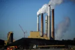 A coal mound stands outside a Kentucky Utilities Co. station.