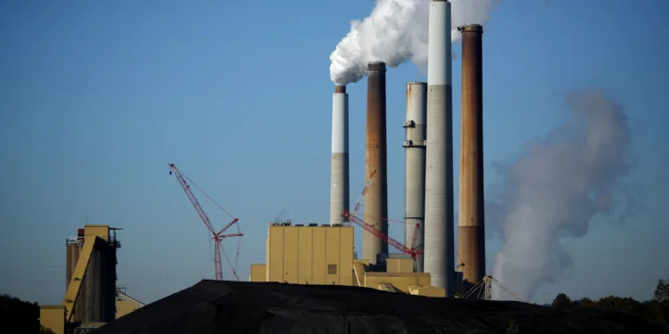 A coal mound stands outside a Kentucky Utilities Co. station.