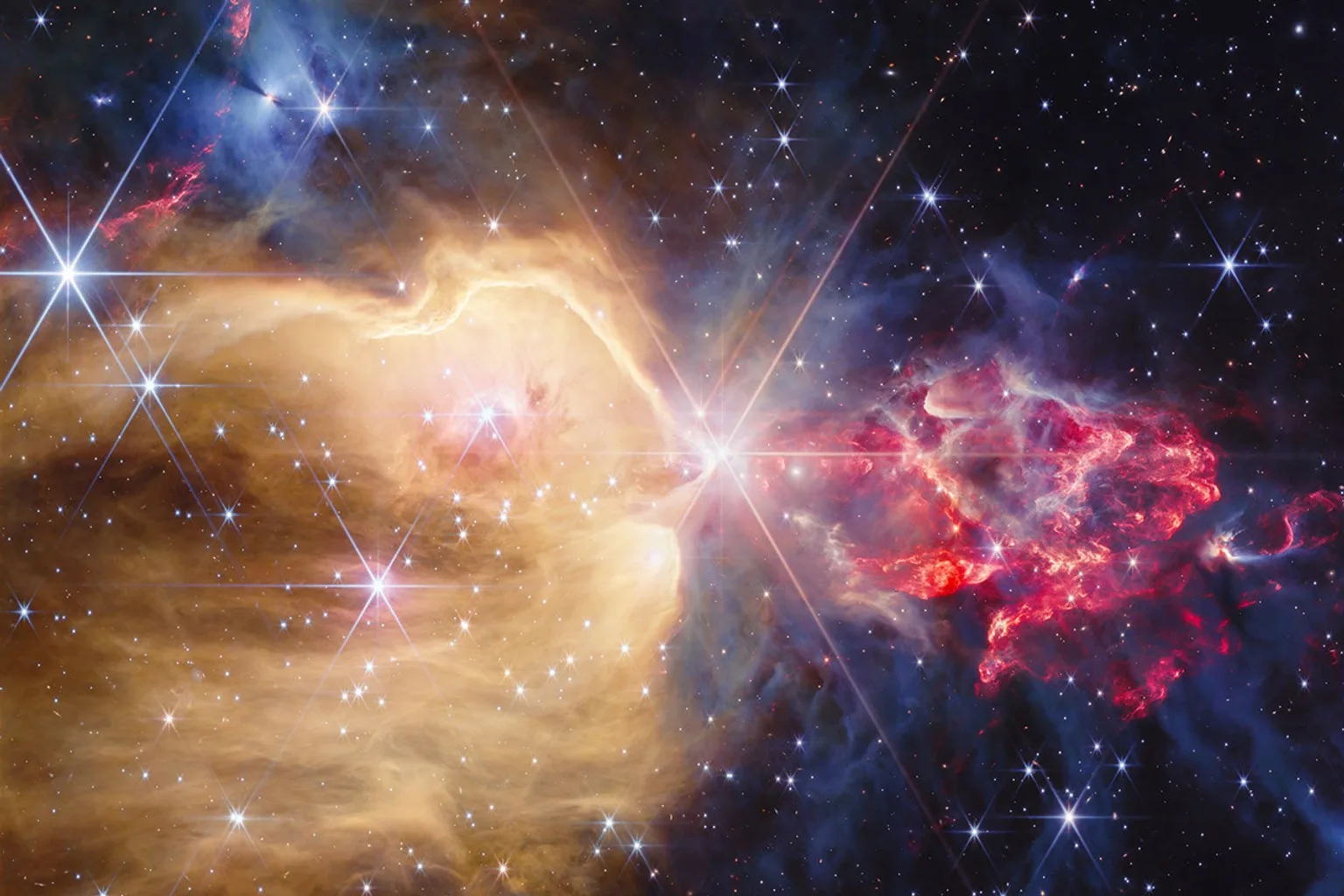 Imagen de la nebulosa NGC 7129, tomada por el Telescopio Espacial James Webb (JWST) de la NASA, en la que se observan numerosas protoestrellas y estrellas dentro del brillante gas de hidrógeno atómico. Crédito: NASA, ESA, CSA, STScI.